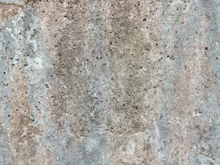 The grunge texture is an old gray concrete wall.