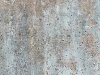 The grunge texture is an old gray concrete wall.