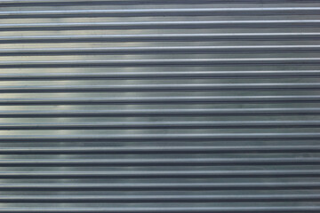 Fototapeta premium Photo of an abstract metal fence horizontal stripes.