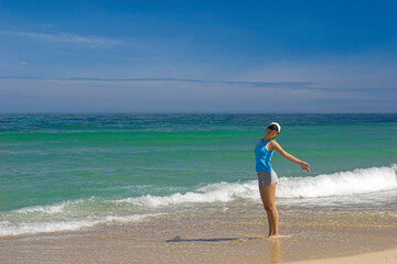 Beautiful woman having fun on the beach