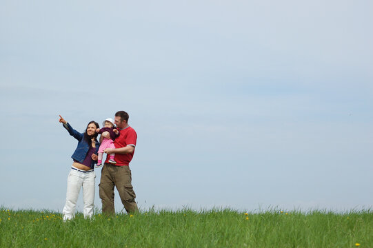 happy family together on green meadow