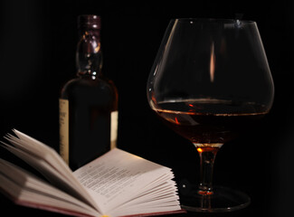 Still Life With Bottle, Glass And Open Book.