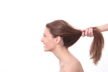 Fototapeta premium Closeup portrait of a happy young woman smiling isolated on white background