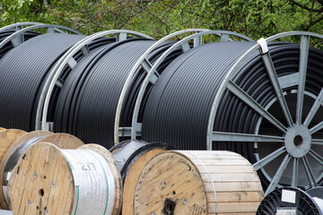 giant rolls of telecommunication cable on construction site