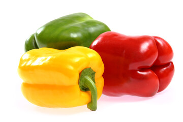 red, yellow and green paprika on white background