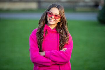 positive fashion teen girl outdoor. fashion teen girl outside. fashion teen girl wear glasses