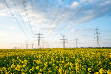 A lot of high-voltage power line, electrical energy transmission tower overhead line masts, high...