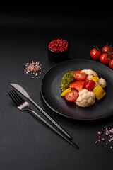 Delicious fresh salad of broccoli, cauliflower, sweet peppers and cherry tomatoes