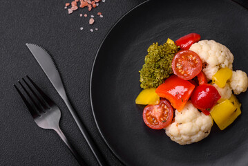 Delicious fresh salad of broccoli, cauliflower, sweet peppers and cherry tomatoes
