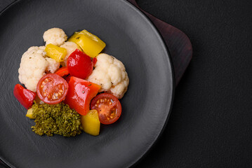 Delicious fresh salad of broccoli, cauliflower, sweet peppers and cherry tomatoes