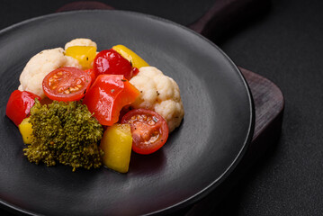 Delicious fresh salad of broccoli, cauliflower, sweet peppers and cherry tomatoes