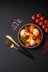 Delicious fresh salad of broccoli, cauliflower, sweet peppers and cherry tomatoes