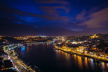 Naklejka na ściany i meble Evening sky over Douro River and cities of Porto and Vila Nova de Gaia, Portugal