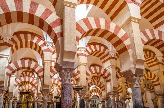 CORDOBA, SPAIN - FEBRUARY 15, 2014: Columns and double-tiered arches in the interior of the Mosque-Cathedral of Cordoba, Andalusia, southern Spain