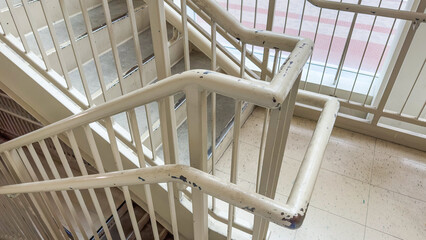 Staircase and side railings symbolize ascension, progression, and safety. They represent the journey towards growth, reaching new heights, and the support needed along the way