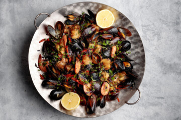 roasted seafood salad with a delectable mix of shrimp, mussels, scallops, and calamari, complemented by vibrant vegetables and flavorful spices