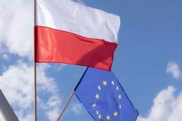 Polish flag against the sky