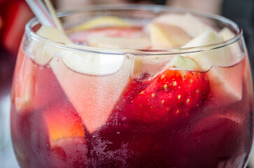 Glass of sangria decorated with fresh fruit