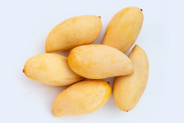Ripe yellow mango fruits on white bckground. Sweet tropical fruit