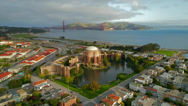 Beautiful sunny morning arial footage around San Francisco Palace of Fine Arts and Golden Gate Bridge. View at marina and highway. 4K Hi Quality drone footage