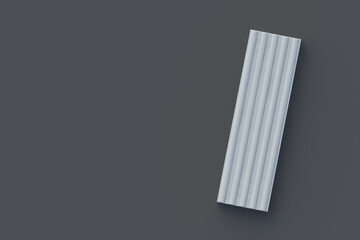 Plasticine brick on black background. Modeling clay. Toy for kids. Preschool education. Top view. Copy space. 3d render