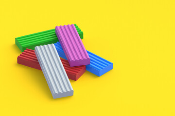 Plasticine bricks on yellow background. Modeling clay. Toy for kids. Preschool education. Copy space. 3d render