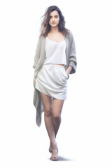 Fototapeta premium Illustration of a young brunette gorgeous girl modeling a beige dress watercolor, created using generative ai tools