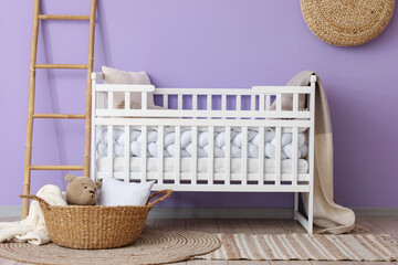 Obraz na płótnie Canvas Interior of children's room with crib, ladder and basket
