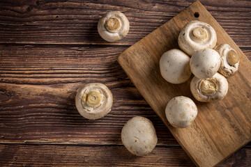 Fototapeta na wymiar Fresh white mushrooms on the table.