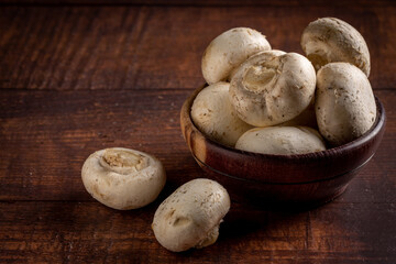 Fresh white mushrooms on the table.