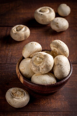 Fresh white mushrooms on the table.