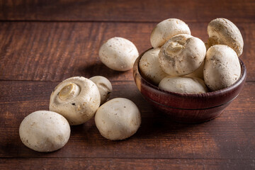 Fresh white mushrooms on the table.