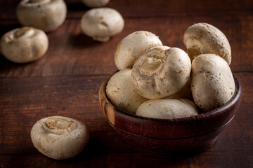 Fresh white mushrooms on the table.