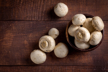 Fresh white mushrooms on the table.