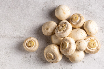 Fresh white mushrooms on the table.