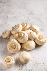 Fresh white mushrooms on the table.
