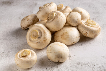 Fresh white mushrooms on the table.