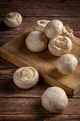 Fresh white mushrooms on the table.
