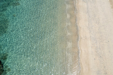 沖縄本島国頭郡国頭村謝敷のビーチをドローンで空撮する風景 Aerial drone...