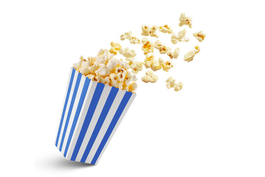 Popcorn flying out of blue white striped paper box isolated on white, transparent background, PNG, with copy space. Splash, levitation of popcorn grains.