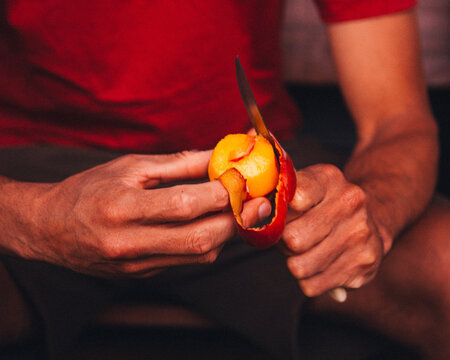 person holding a peach