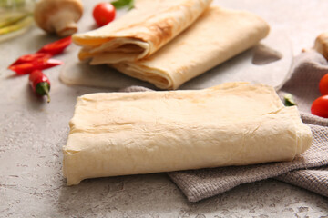 Fresh lavash on grey background