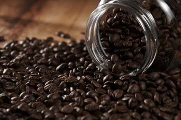 coffee beans in a lying glass
