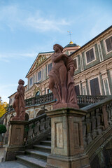 Fototapeta na wymiar Statue, Frau aus Stein, am Schloss Favorite, Foerch im öffentlichen Park