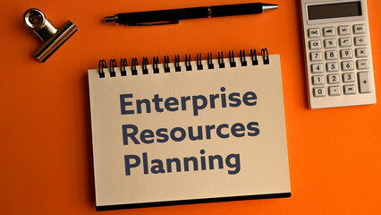 There is notebook with the word Enterprise Resources Planning.It is as an eye-catching image.