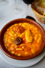 Fabada asturiana, Asturian bean stew, Spain, hot and heavy dish served with Asturian cider or a red wine, made with fabes de la Granja large white beans, shoulder pork, pancetta or bacon