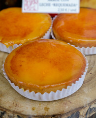 Fresh baked pastries and sweets on display in artisan Spanish confectionery shop, rice and milk cake