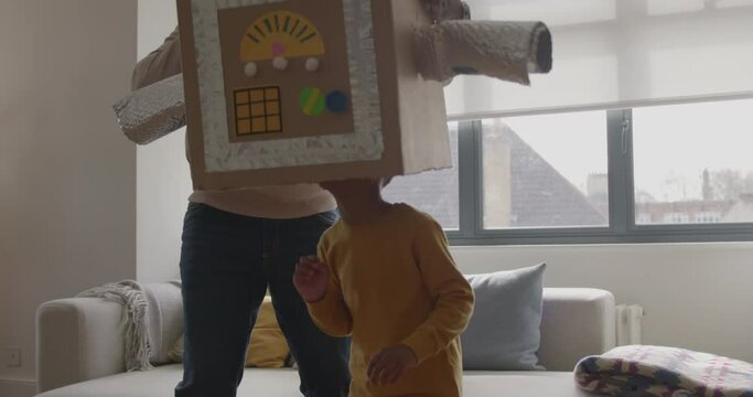 Father and Child playing with Robot at Home