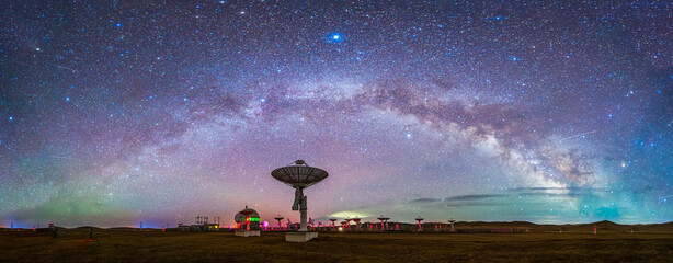 In observatories, satellite antenna radio telescope on the background of stellar tracks, radio telescope on the background of stellar tracks,  The observatory's radio telescope