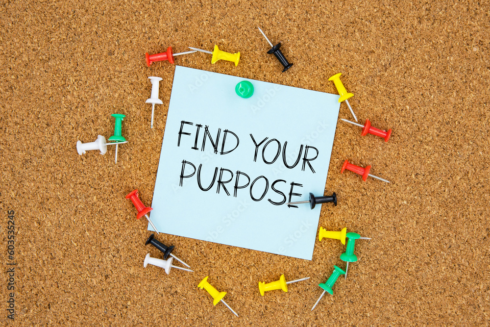 Poster find your purpose text on light blue post-it paper pinned on bulletin cork board surrounding by mult
